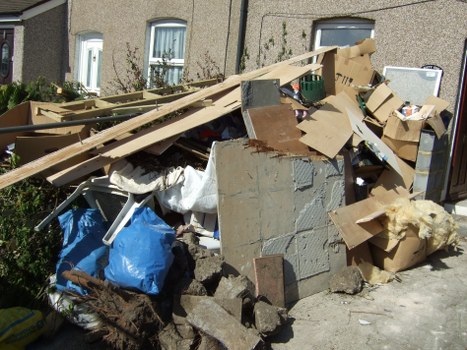 Residential area with a skip bin placed on the sidewalk